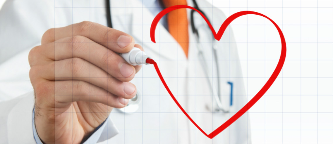 a doctor draws a heart on a window in red pen, illustrating our discussion regarding cardiovascular disease