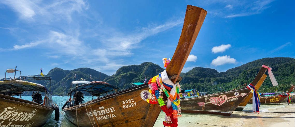 Image of traditional boat and beach in Thailand