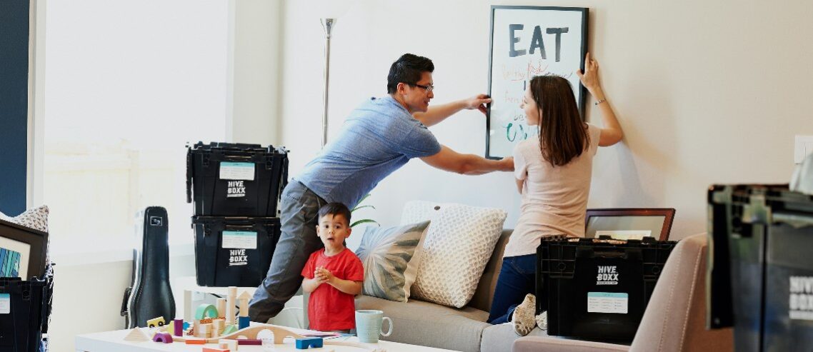 Family unpacking in new home.