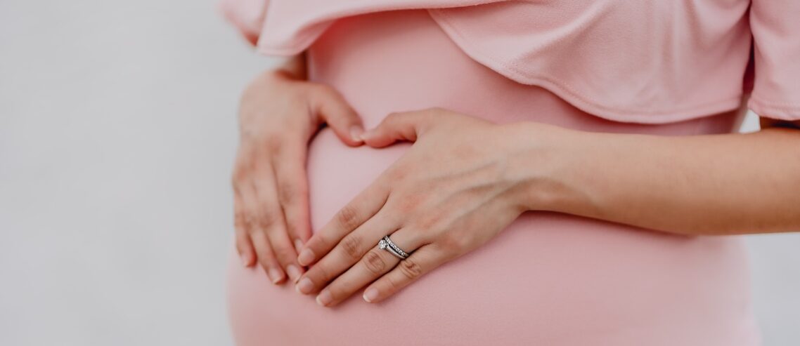 Pregnant mother dressed in pink