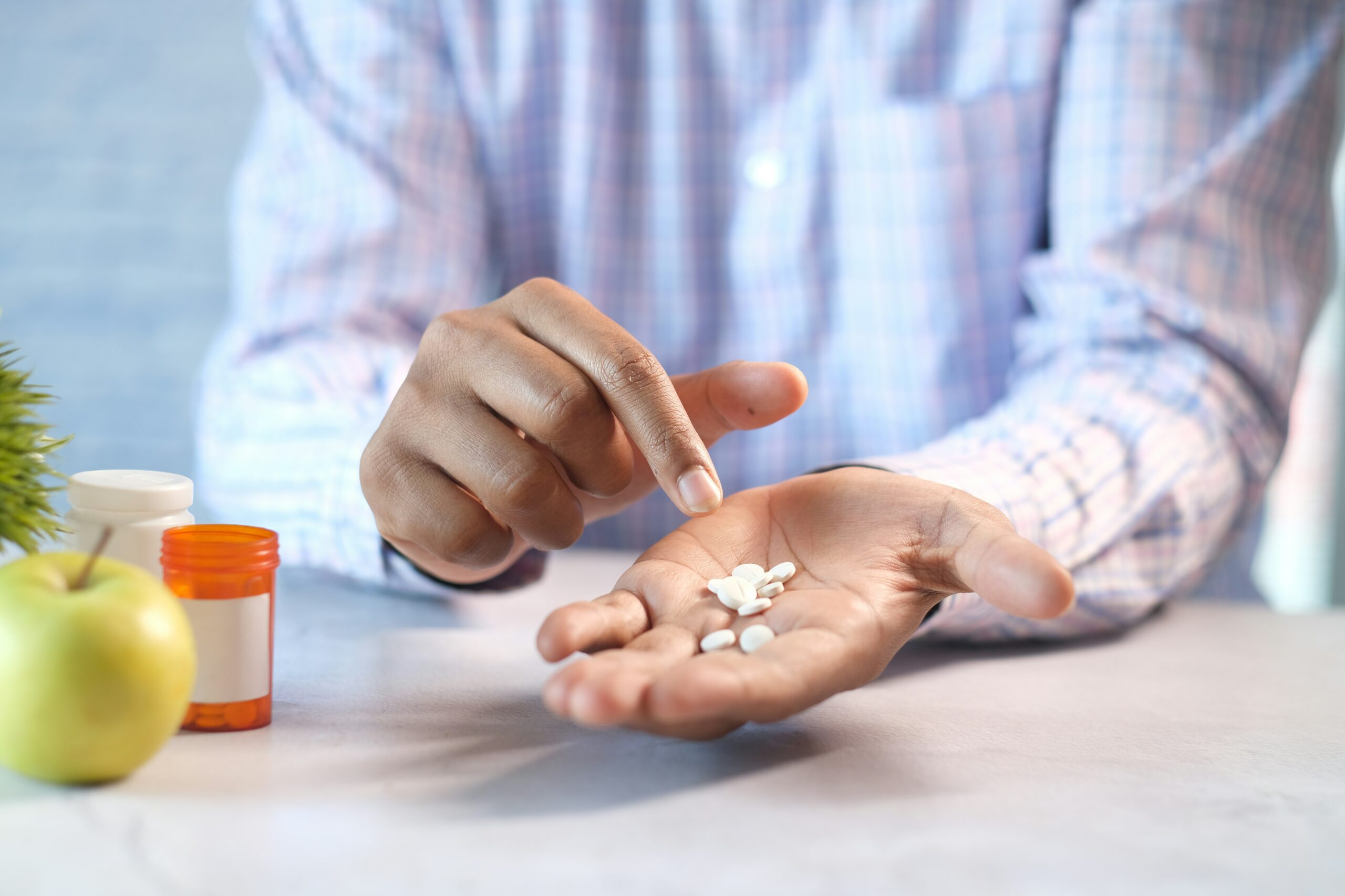 a doctor holding the pills in his hand